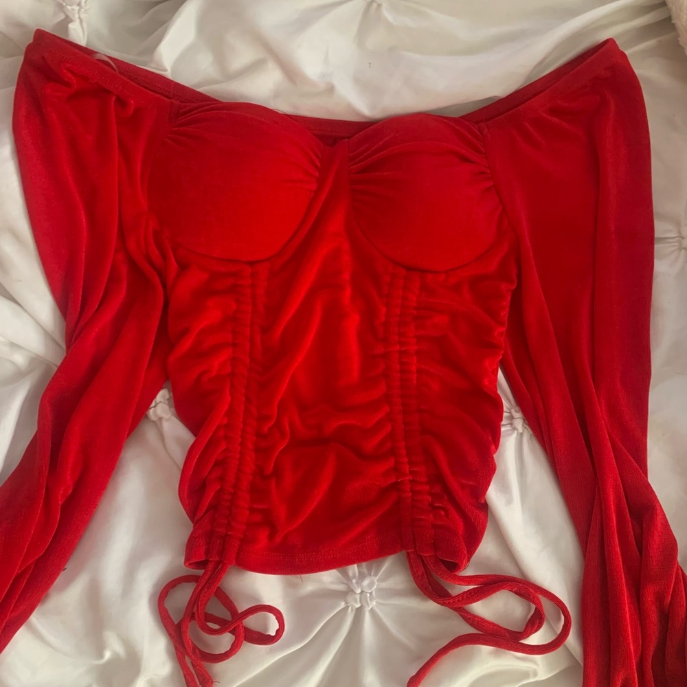 Small red blouse.